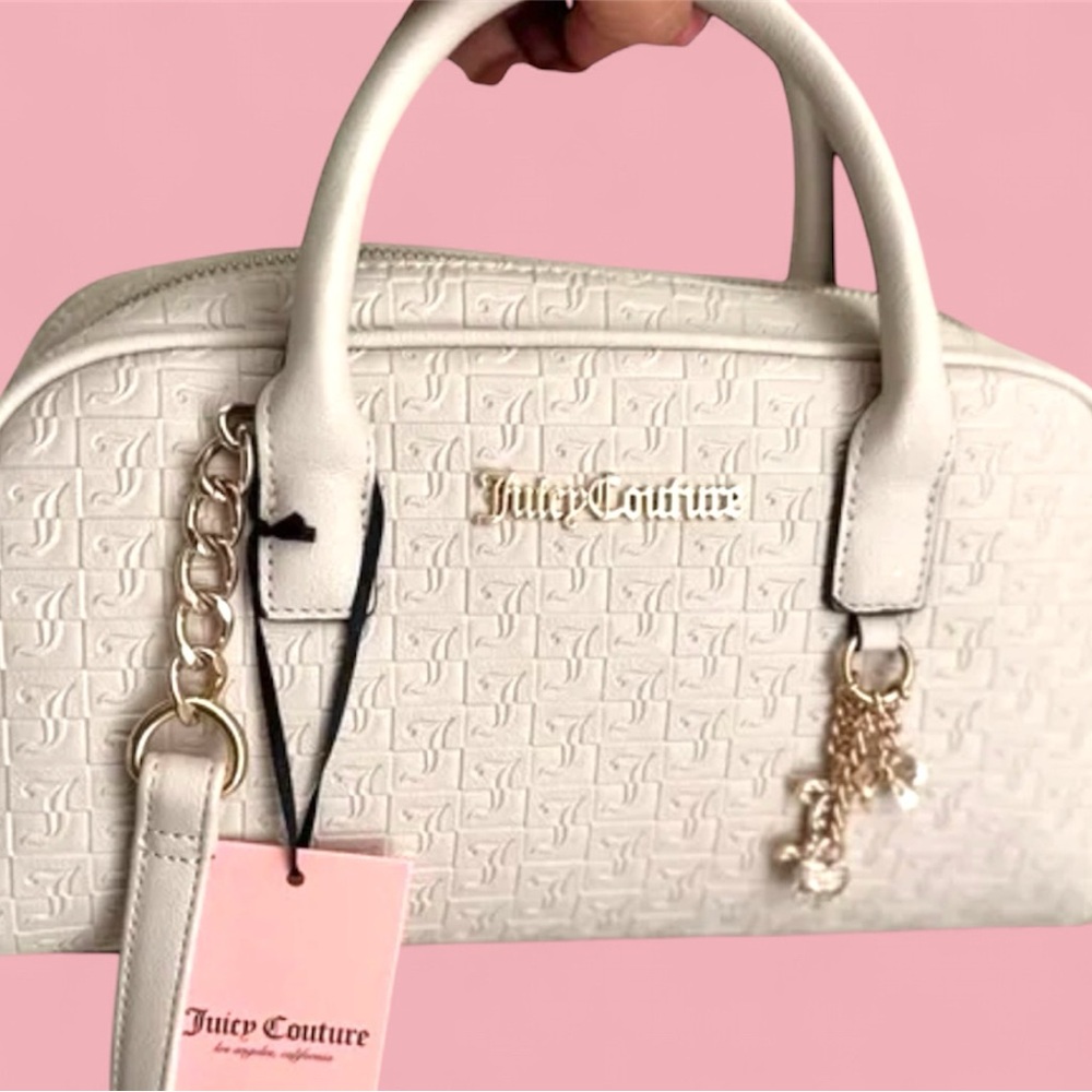 Juicy Couture Lucky Charms Satchel in a light cream/vanilla color. NWT